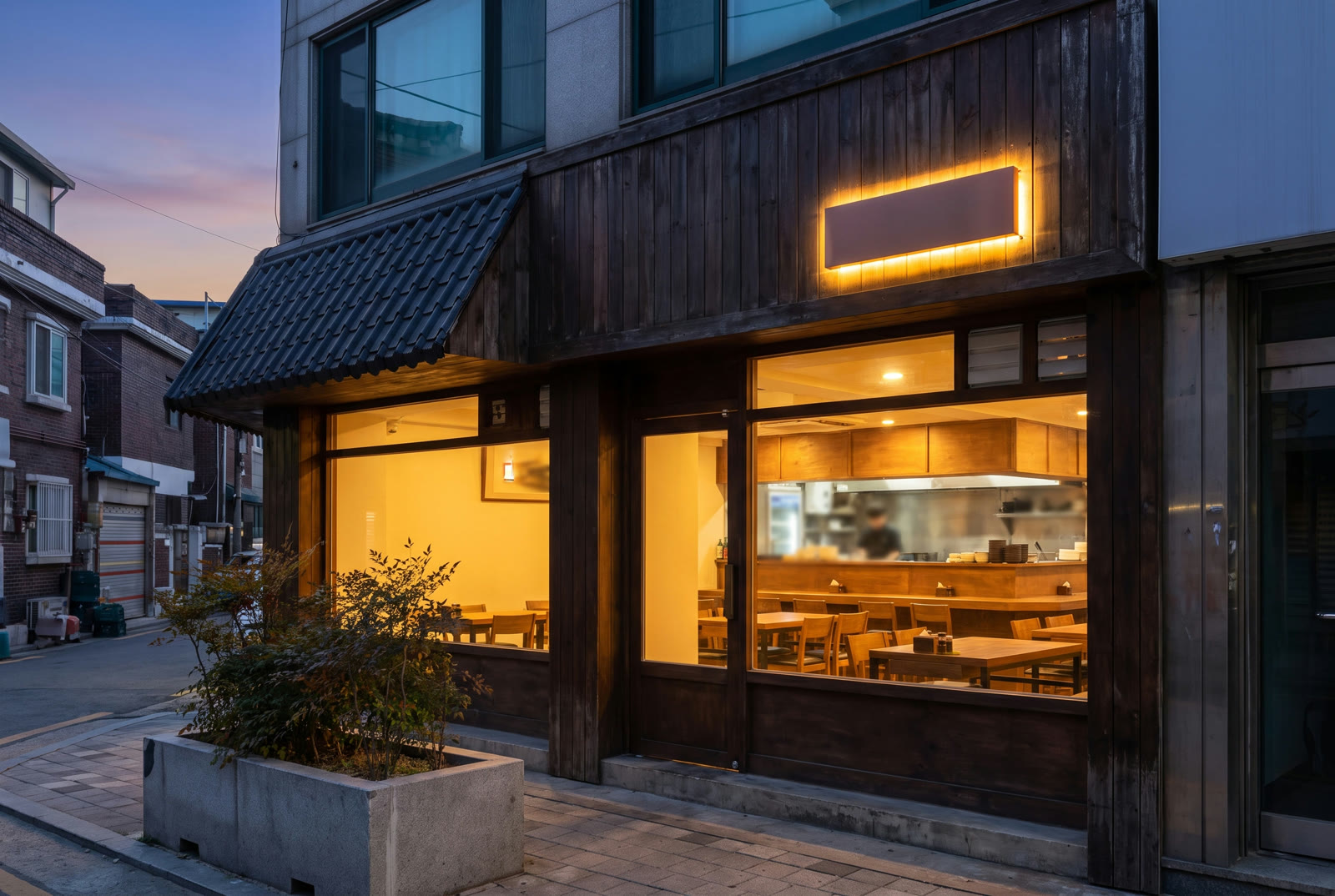Hanok Table storefront glowing at dusk