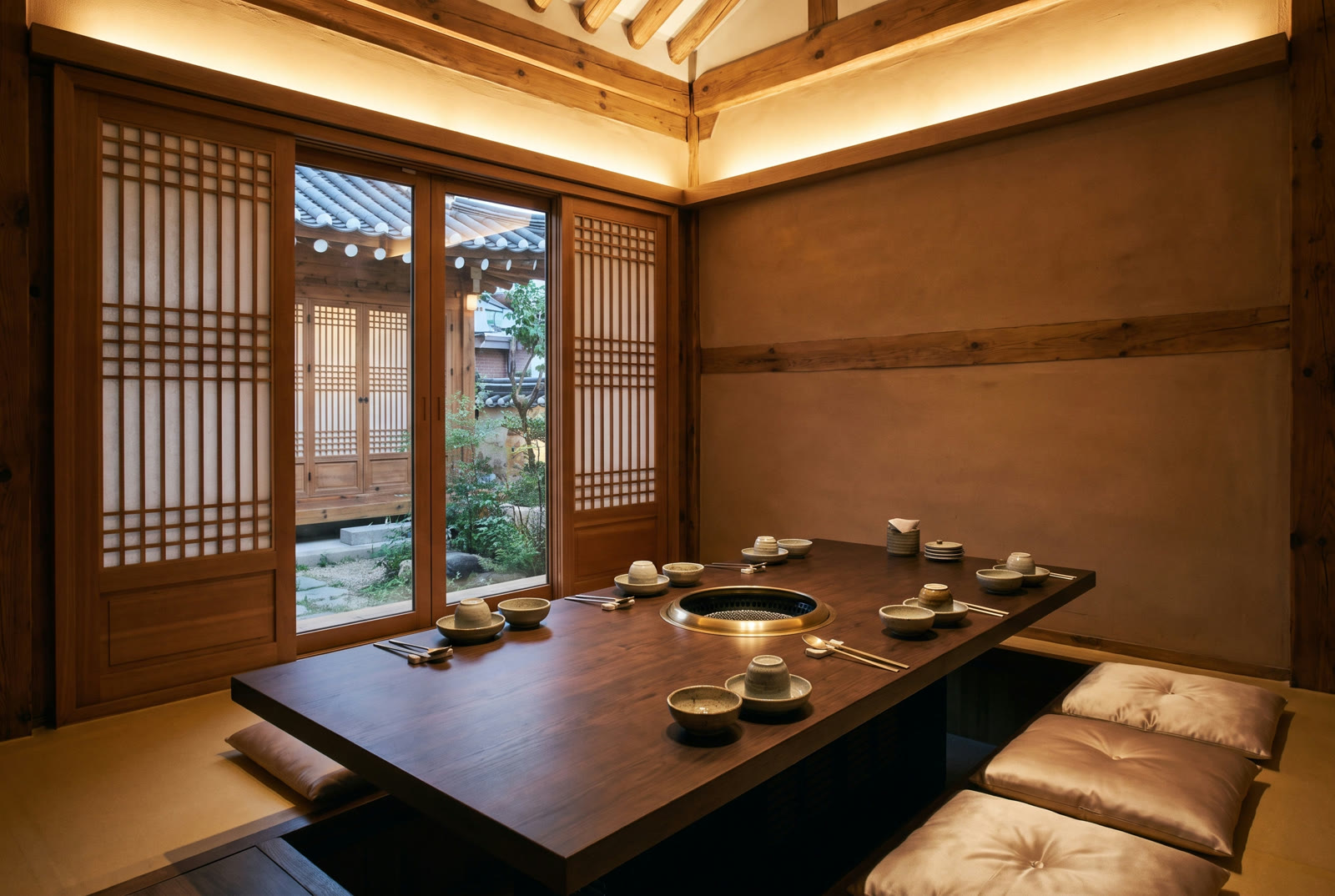 Private room with a low wooden table set for six